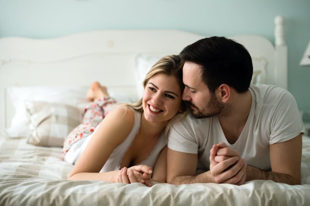 1739910016 couple in love wearing pajamas lying in bed LP8T49S 1739910016 couple in love wearing pajamas lying in bed LP8T49S