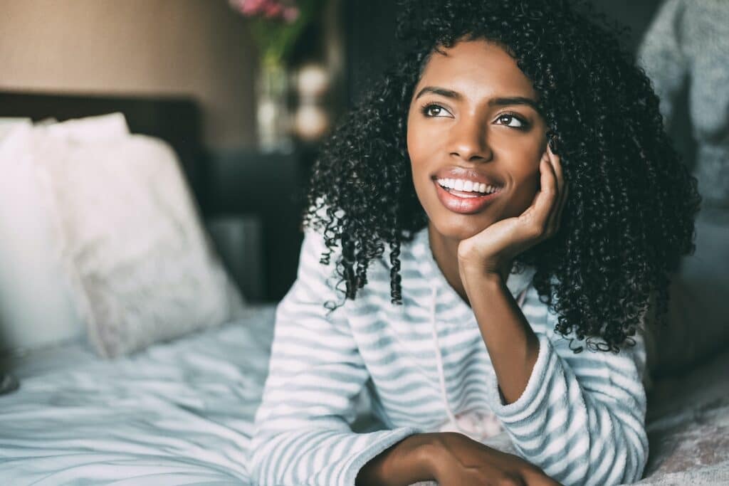 1739910068 close up of a pretty black woman with curly hair s 7J2UVPN