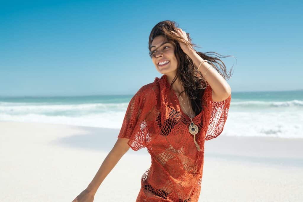 happy fashion woman running on beach QUNMBKK happy fashion woman running on beach QUNMBKK