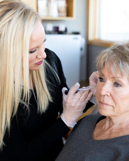 An older woman receives a BOTOX® injection near her “crow’s feet” by clinician Chrissy at Premier Skin Clinic An older woman receives a BOTOX® injection near her “crow’s feet” by clinician Chrissy at Premier Skin Clinic